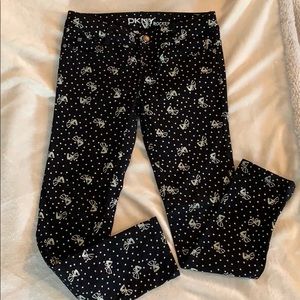 Girls DKNY jeans with silver glitter bows on them.